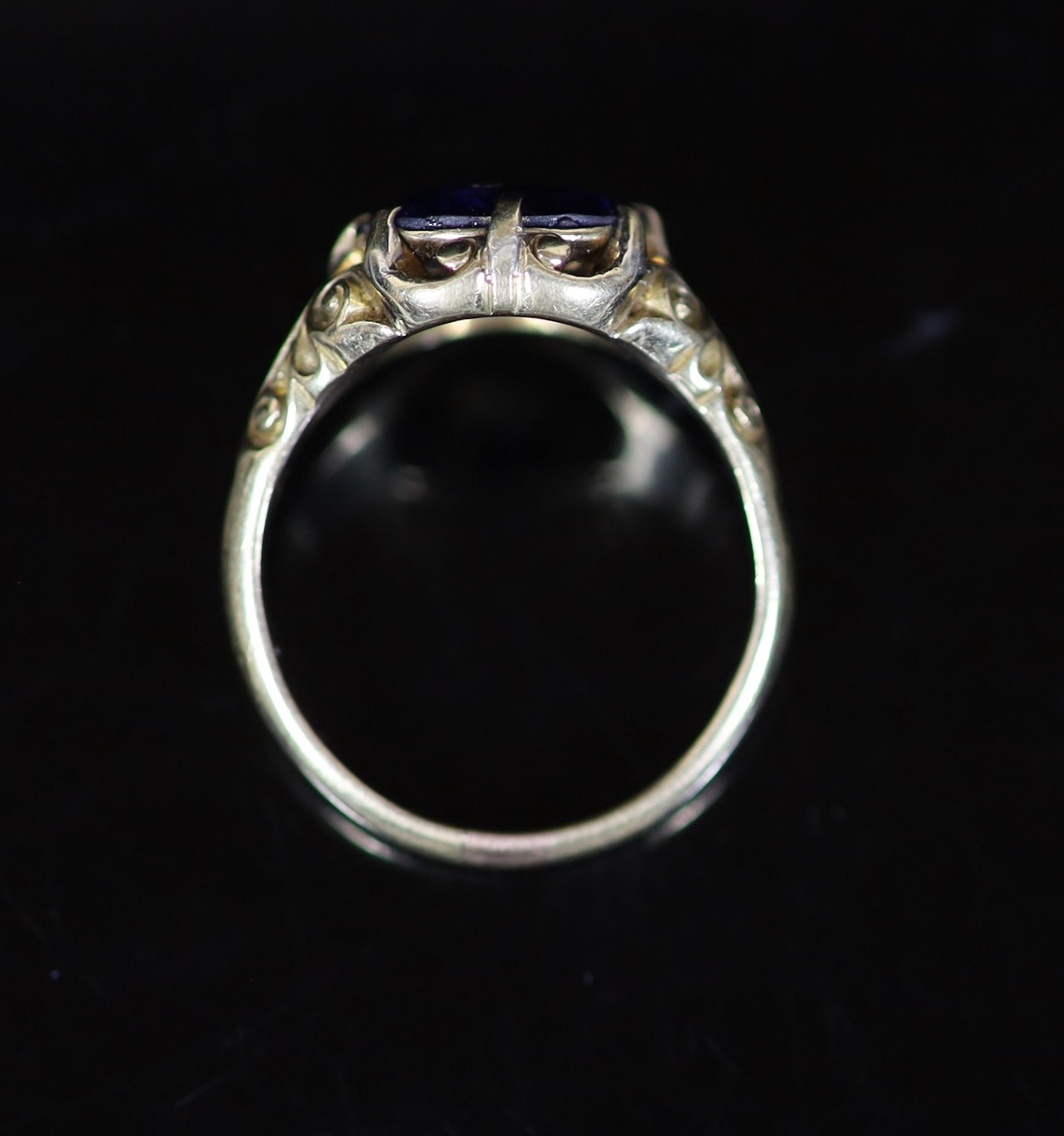 An 18ct gold and single stone claw set sapphire ring